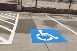 Blue Handicap Symbol In Parking Lot - Grand Prairie, TX